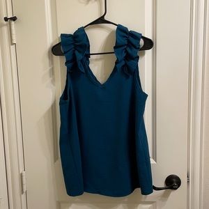 Ruffle shoulder sleeveless blouse